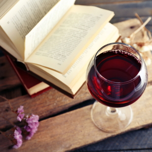 Rayner Mansion wine beside books for a quiet evening.